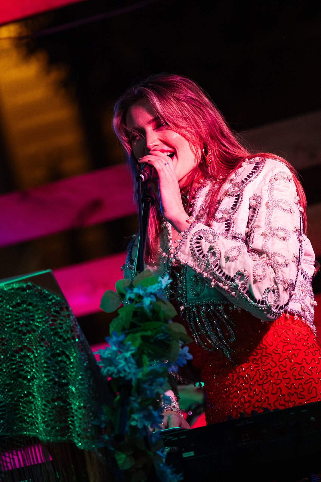AnaBelle E singing on stage